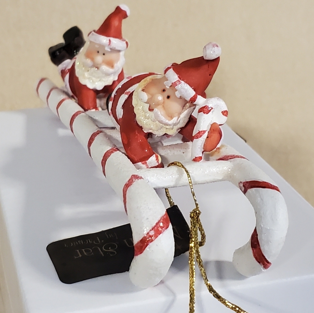 Santa's on a Candycane Ladder Ornament